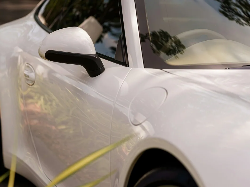 paint protection film being laid on a bonnet