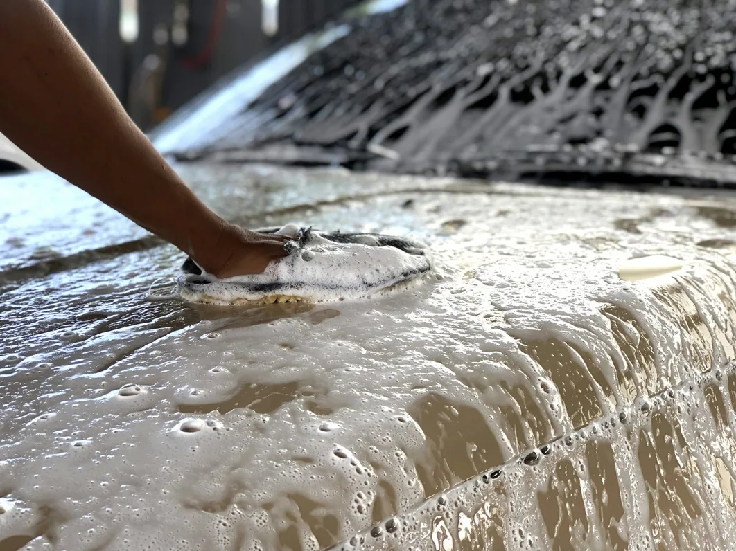 hand wash of a coated car, foam and mitt