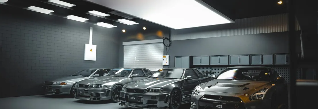 two finished cars in the studio, wide