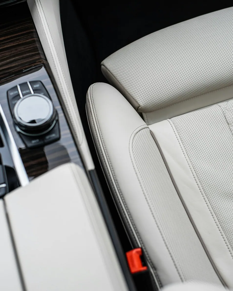 interior being detailed — dashboard or seats wiped, upright